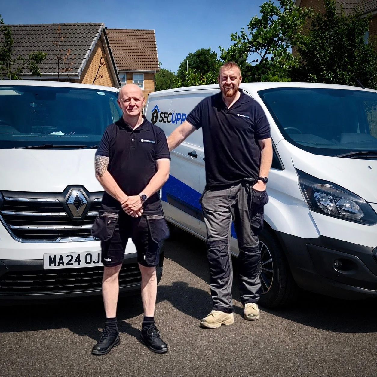Shaun Bradford and Rich Gannon of Secupro with the company vans