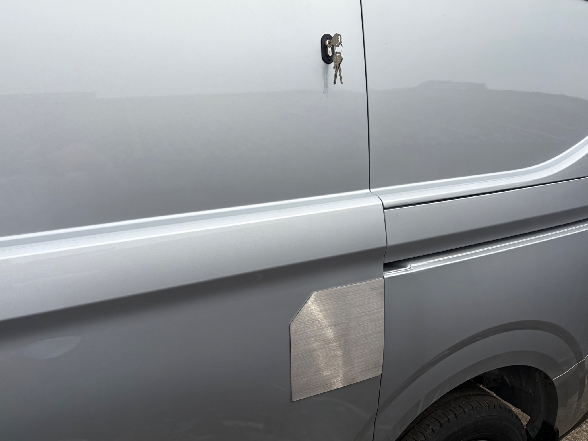 Hook lock and stainless steel security plate fitted to the sliding side door of a van in Beverley