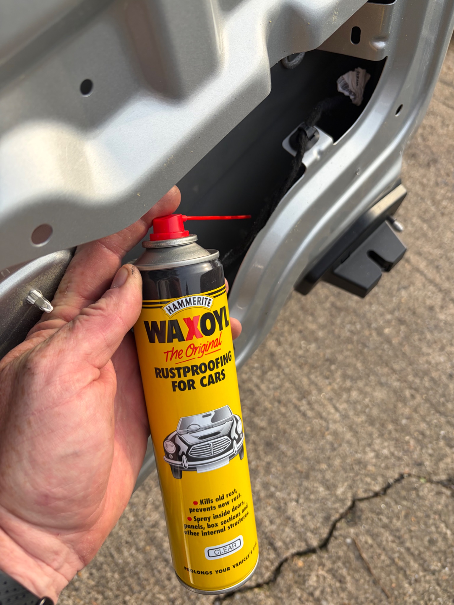 Waxoyl applied inside the van door after fitting hook locks in Beverley